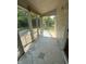 Tiled sunroom patio with screen enclosure at 3350 Shore Dr, Greenwood, IN 46143