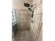 Features a spacious tiled shower with overhead and handheld shower heads at 3350 Shore Dr, Greenwood, IN 46143