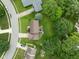 Overhead view reveals the home's backyard, complete with a deck and lush landscaping at 3439 Eden Park Dr, Carmel, IN 46033