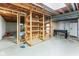 Unfinished basement featuring concrete floor, wood frame stairs, and utilities at 3439 Eden Park Dr, Carmel, IN 46033