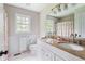 Bathroom featuring double sinks, granite countertop, white cabinetry, and shower at 3439 Eden Park Dr, Carmel, IN 46033