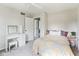 Bright bedroom featuring a bed, vanity, and ample natural light at 3439 Eden Park Dr, Carmel, IN 46033