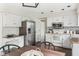 Updated kitchen with stainless steel appliances and an adjacent eating area at 3439 Eden Park Dr, Carmel, IN 46033