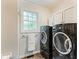 Convenient laundry room with front-load washer and dryer at 3439 Eden Park Dr, Carmel, IN 46033