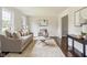 Cozy living room featuring hardwood floors, neutral decor, and stylish furnishings at 3439 Eden Park Dr, Carmel, IN 46033