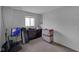 Minimalist bedroom with carpet floors, a window, and essential furniture; ideal for customization at 3509 N Wittfield St, Indianapolis, IN 46235