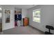 Bedroom boasts a window, closet, dresser, and neutral carpet at 3509 N Wittfield St, Indianapolis, IN 46235