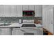 Well-equipped kitchen with white cabinets, modern appliances, and sleek countertops at 3509 N Wittfield St, Indianapolis, IN 46235