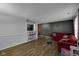 Open-concept living room with hardwood floors and a bar area, perfect for entertaining and relaxation at 3509 N Wittfield St, Indianapolis, IN 46235