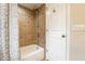 Classic bathroom with tiled shower and tub combination, complete with a shower curtain and updated fixtures at 3715 Rolling Springs Dr, Carmel, IN 46033