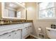 Traditional bathroom with white vanity, granite countertop, decorative mirror and tile flooring at 3715 Rolling Springs Dr, Carmel, IN 46033
