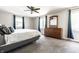 Spacious bedroom with neutral walls, carpet, ceiling fan, and a large dresser with a mirror at 3715 Rolling Springs Dr, Carmel, IN 46033