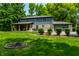 Spacious two-story home with a large backyard, covered patio, attached garage, and mature landscaping at 3715 Rolling Springs Dr, Carmel, IN 46033