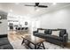 Inviting living room with an open layout with a modern kitchen, access to the backyard, and comfortable seating at 3715 Rolling Springs Dr, Carmel, IN 46033