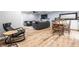 Cozy living space with wood floors, dining table, chairs, and comfortable seating at 3715 Rolling Springs Dr, Carmel, IN 46033
