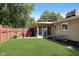 Spacious backyard with a patio, seating, lush lawn, and privacy fence at 3740 Cheviot Pl, Indianapolis, IN 46205