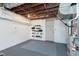Spacious unfinished basement with exposed ceiling and painted floors at 3740 Cheviot Pl, Indianapolis, IN 46205