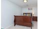 Simple bedroom with a hardwood bed frame, side table, and lamp at 3740 Cheviot Pl, Indianapolis, IN 46205