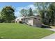 Charming brick home with a well-manicured lawn and mature trees at 3740 Cheviot Pl, Indianapolis, IN 46205