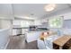Bright kitchen connected to dining area with modern appliances, lots of counter space and white cabinets at 3740 Cheviot Pl, Indianapolis, IN 46205