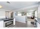 Kitchen with stainless appliances is open to other living areas at 3740 Cheviot Pl, Indianapolis, IN 46205