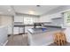 Bright kitchen with a breakfast bar, stainless steel appliances, and ample cabinet space at 3740 Cheviot Pl, Indianapolis, IN 46205