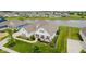 Aerial view of a home, showcasing landscaping, and nearby lake at 3821 Shady Lake Dr, Westfield, IN 46074