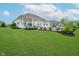 Spacious backyard with green lawn, patio and inground swimming pool at 3821 Shady Lake Dr, Westfield, IN 46074