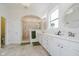 Bright bathroom boasts double sinks, white cabinets, framed mirrors, and a spacious tiled shower at 3821 Shady Lake Dr, Westfield, IN 46074