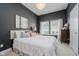 Comfortable bedroom with a queen bed, decorative pillows, and plenty of natural light at 3821 Shady Lake Dr, Westfield, IN 46074