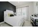 Charming bedroom with natural light, white bed and modern black and white decor at 3821 Shady Lake Dr, Westfield, IN 46074
