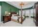 Spacious bedroom with tray ceiling, four-poster bed, and bay windows offering plenty of natural light at 3821 Shady Lake Dr, Westfield, IN 46074