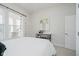 Bright bedroom with a view to backyard, complemented by modern decor and furnishings at 3821 Shady Lake Dr, Westfield, IN 46074