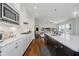 Bright kitchen featuring a large island, stainless steel appliances, and hardwood floors at 3821 Shady Lake Dr, Westfield, IN 46074