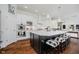 Kitchen with black island, white countertops, pendant lighting, and stainless steel appliances at 3821 Shady Lake Dr, Westfield, IN 46074