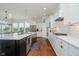 Bright kitchen featuring a large island, stainless steel appliances, and hardwood floors at 3821 Shady Lake Dr, Westfield, IN 46074