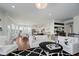 Spacious living room with hardwood floors, open to kitchen, and an abundance of natural light at 3821 Shady Lake Dr, Westfield, IN 46074