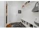 Mud room with black and white dot pattern, storage rack, and back door at 3821 Shady Lake Dr, Westfield, IN 46074