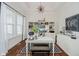 Bright office with hardwood floors, built-in shelving, and a modern light fixture at 3821 Shady Lake Dr, Westfield, IN 46074