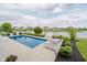 Backyard pool with lounge chairs and scenic pond views at 3821 Shady Lake Dr, Westfield, IN 46074