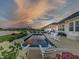 Gorgeous in-ground pool and outdoor dining with stunning sunset views at 3821 Shady Lake Dr, Westfield, IN 46074