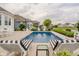 Backyard pool area with lounge seating and manicured landscaping at 3821 Shady Lake Dr, Westfield, IN 46074
