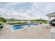 Inviting pool area with lounge seating, string lights, and a picturesque waterfront view at 3821 Shady Lake Dr, Westfield, IN 46074