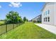 A large fenced-in backyard with green grass and landscaping at 4253 Ironclad Dr, Bargersville, IN 46106