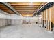 Large unfinished basement with exposed wooden beams, concrete foundation, and open space at 4253 Ironclad Dr, Bargersville, IN 46106