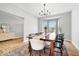 Formal dining room featuring a large table, bay windows, and contemporary chandelier at 4253 Ironclad Dr, Bargersville, IN 46106