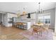 Modern kitchen featuring white cabinetry, stainless steel appliances, and a breakfast bar at 4253 Ironclad Dr, Bargersville, IN 46106
