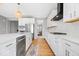 Bright, modern kitchen features white cabinets, stainless steel appliances, and a stylish island at 4253 Ironclad Dr, Bargersville, IN 46106