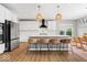 Bright, modern kitchen featuring white cabinets, stainless steel appliances, and a center island at 4253 Ironclad Dr, Bargersville, IN 46106