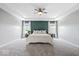 Spacious main bedroom with tray ceiling, plush carpeting, and views to the outdoors at 4253 Ironclad Dr, Bargersville, IN 46106